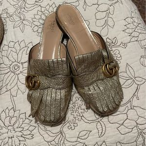 Gucci gold tassel slip ons